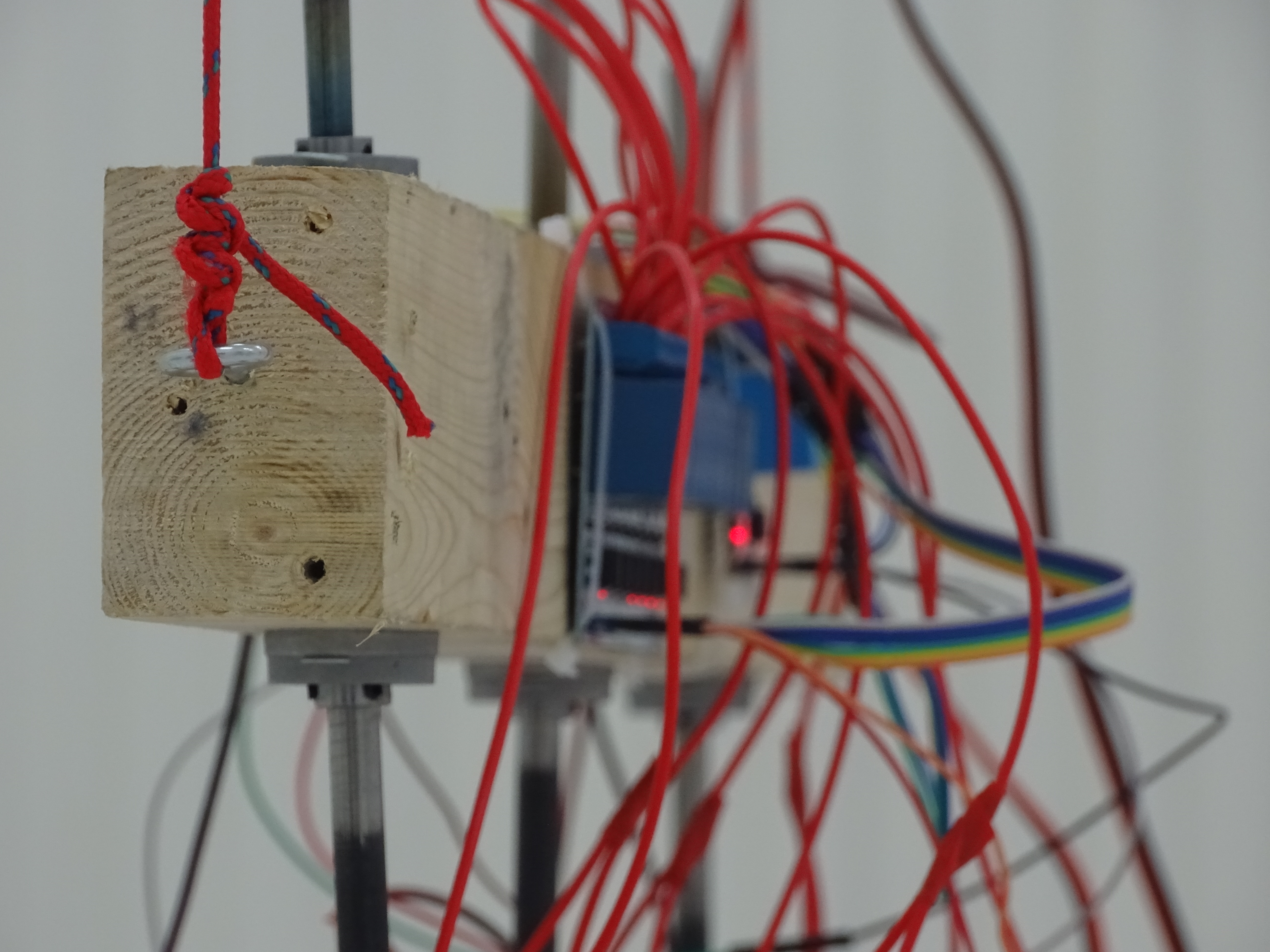 Wood, wires, motors close up. Nothing is enclosed behind a panel that says do not look here.